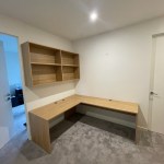 Custom corner desk with shelving above