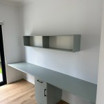Green laminate custom fitted desk and shelf