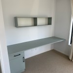 Green laminate custom fitted desk and shelf