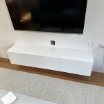 Small white entertainment unit wall mounted