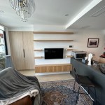 Oak wall mounted TV unit with floating shelves