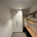 Custom fitted desk and cupboard with a fold down murphy bed