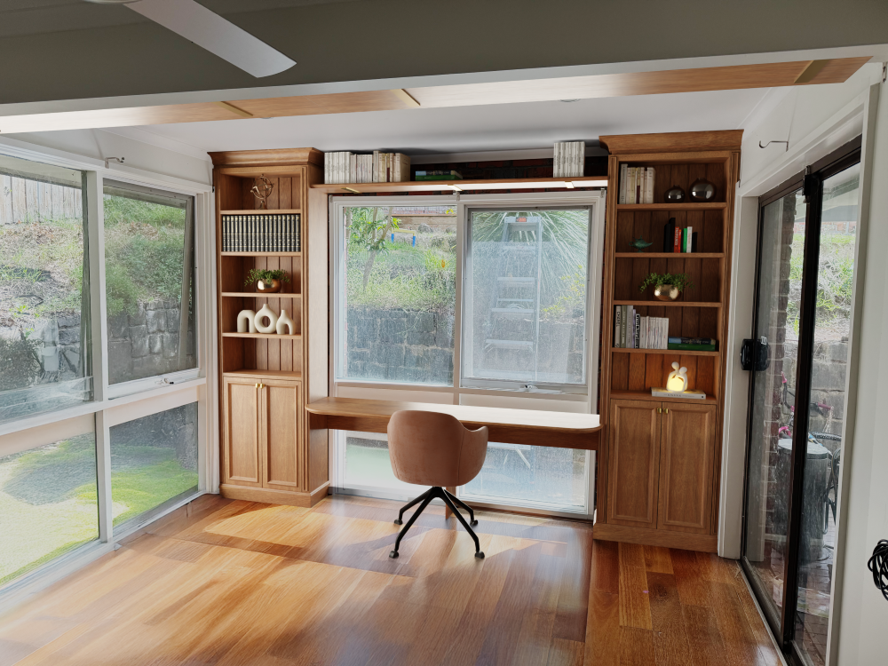 Custom oak open home office against window